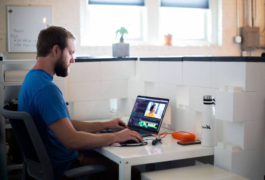 A Kalamazoo web designer works on editing a video.