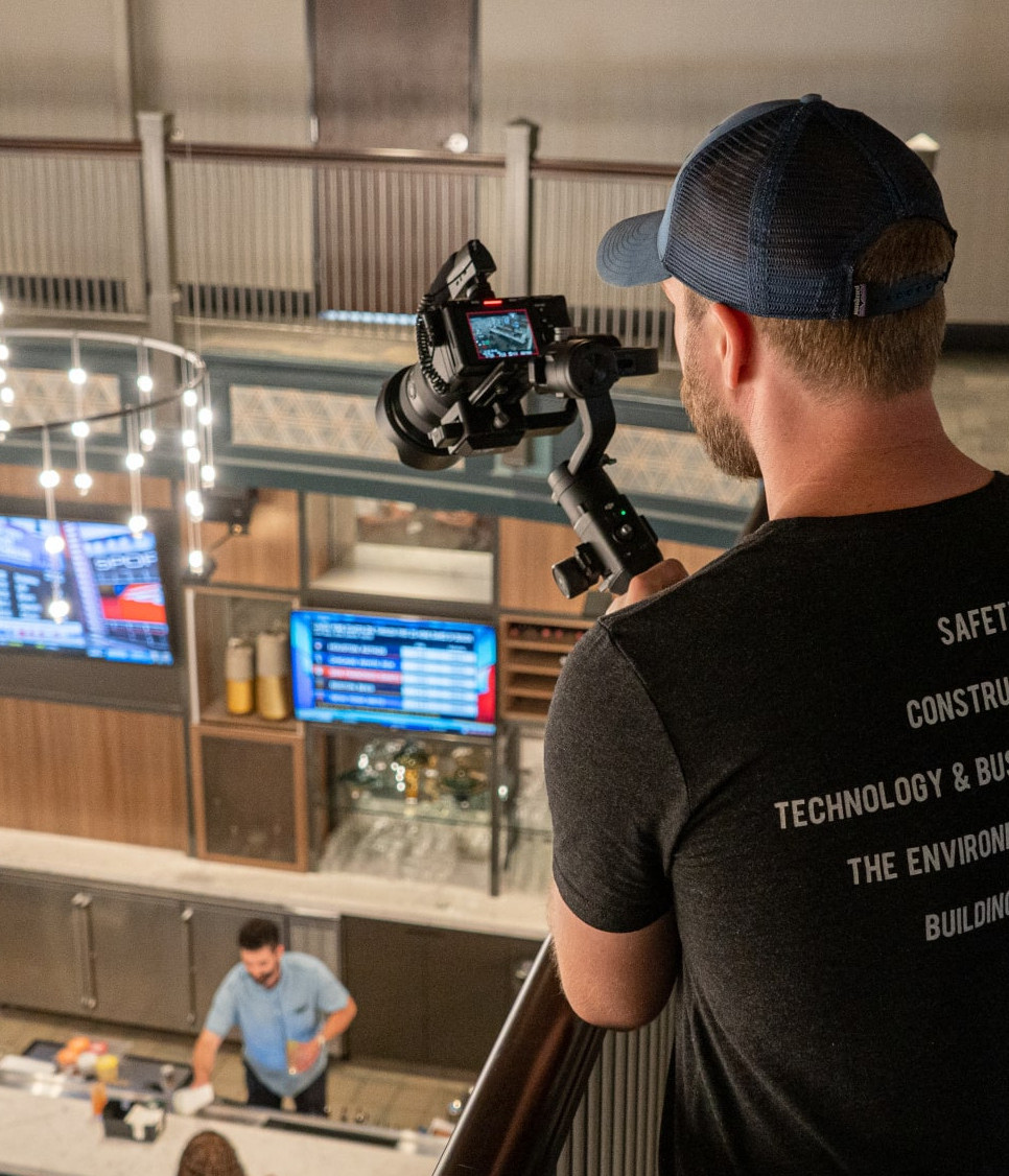 Kzoom's videographer filming on site.